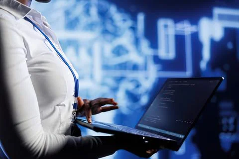 Woman using laptop with tech background Stock Photos
