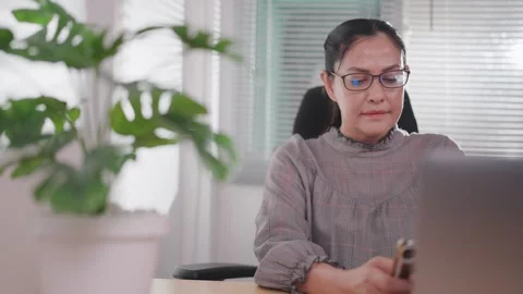 Woman using laptop technology, checking email, viewing website, working remotely Stock Footage 276723418