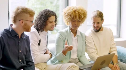 Woman using laptop while talking with colleagues in a coworking Video stock 262220170