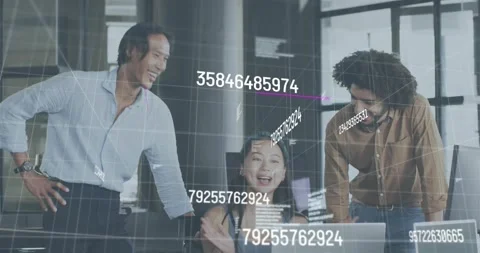 Woman using laptop while team tapping phone manipulating data visuals for joint Stock Footage 317330076