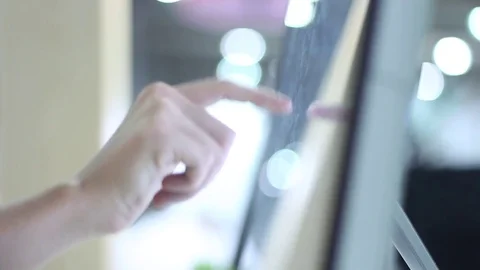 Woman using a large touch screen monitor Stock Footage 72381518