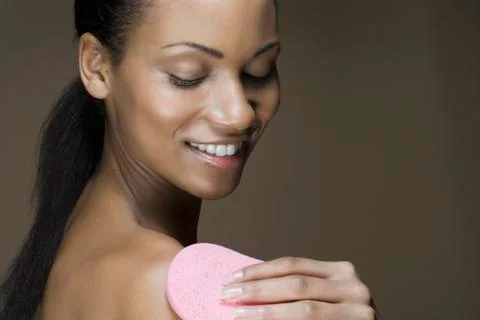A woman using a luffa Stock Photos
