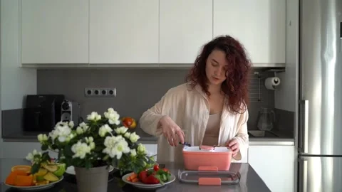 Woman using lunchbox kitchen Stock-Footage 240573519