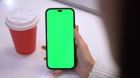 Woman using mobile phone vertical green screen. Female holding portable gadget Stock Footage 270961727