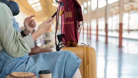 Woman using mobile phone while travel by train. travel concept Stock-Fotos