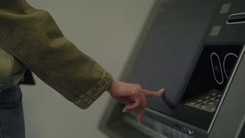 Woman using a modern ATM touchscreen machine Video stock 345518825