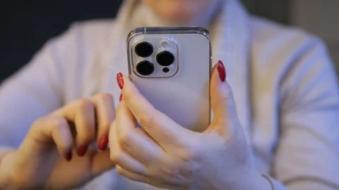 A woman is using a modern smartphone to demonstrate the latest communication Stock Footage 276965824