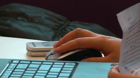 Woman using mouse at laptop Stock Footage 25859382