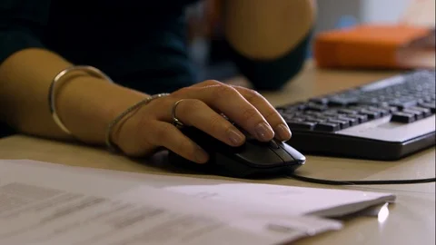 Woman Using Mouse Pan Right Stock Footage 127035727
