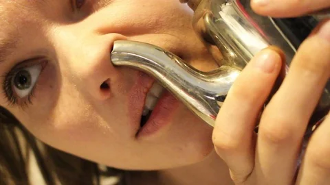 Woman using neti pot Stock Footage 105526641