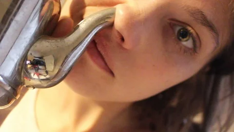 Woman using neti pot Stock Footage 105526652