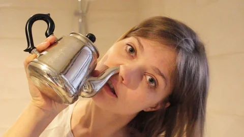 Woman using neti pot Stock Footage 105526653