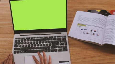 Woman using notebook on a table Stock Footage 125373569