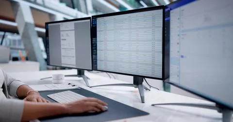Woman Using Office Invoice Software For Payroll Processing In Medical Office. Stock Photos