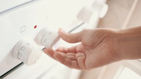 Woman Using Oven Controls Stock Footage 92577052