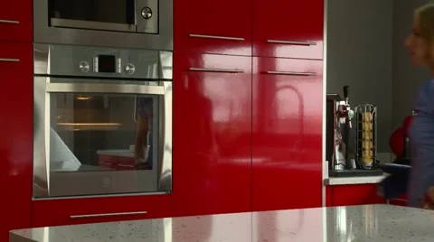 Woman using oven Stock Footage 40741317