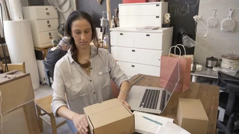 Woman using packing box in craft workshop 스톡 동영상 220967981