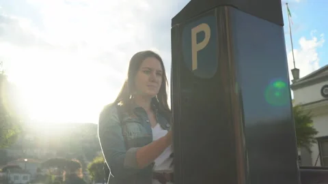 Woman using parking machine on the street. Stock Footage 111341637
