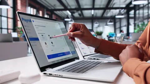 Woman Using Payroll App To Pay Salaries Stock Footage 328407176