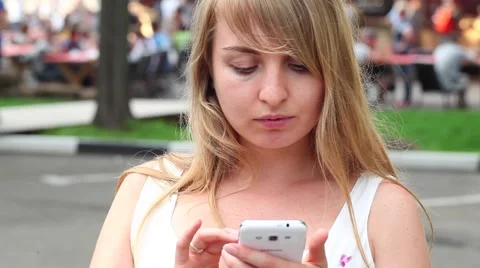 Woman using a phone Video stock 66551897