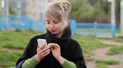 Woman using a phone Video stock 67831910