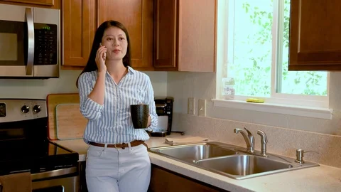 Woman using phone leaning at table with coffee Stock Footage 112121561