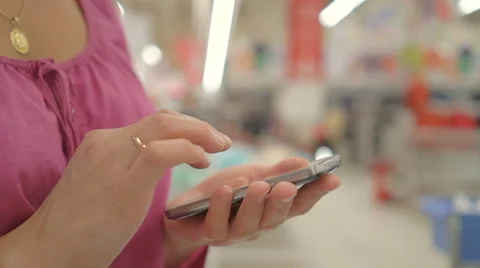 Woman Using the Phone in the Store Stock Footage 67378174