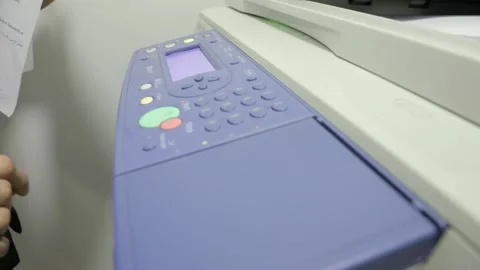 Woman using printer or scanner in office . Office worker use print machine Stock Footage 148272541