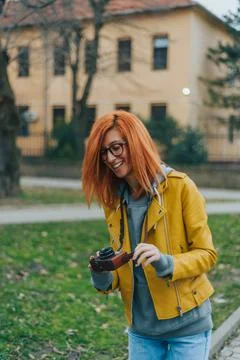 Woman using a retro analog camera Stock Photos