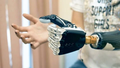 Woman using robot-assisted bionic arm. Video stock 82293464