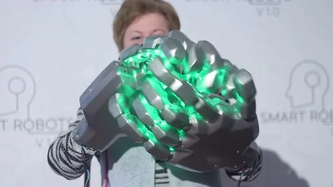 Woman using a robotic glove Stock Footage 81787600