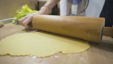 Woman using rolling pin makes christmas cookies close up Video stock 146211545