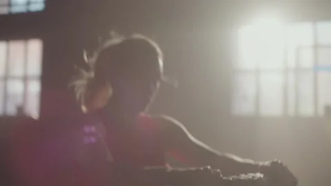 Woman using rowing machine 스톡 동영상 236182140