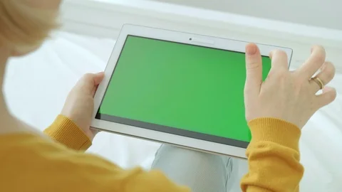 Woman using scrolling on digital tablet computer with green screen chroma key. Stock Footage 94142461