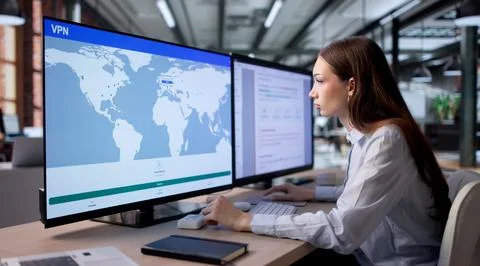 Woman Using Secure VPN On Computer To Safely Access Private Network. Stock Photos