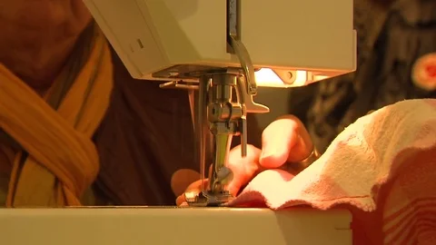 Woman using sewing machine close-up Stock Footage 82009627