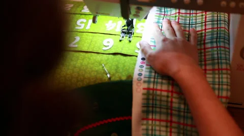 Woman using a sewing machine to make advent calendar Video stock 32638197