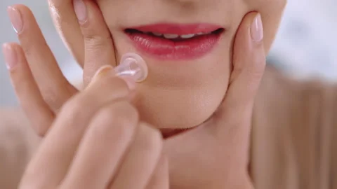 Woman using silicone cup for doing facial massage at home, female cupping around 스톡 동영상 231482669