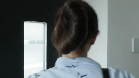 Woman using smart home security system Stock Footage 147869813
