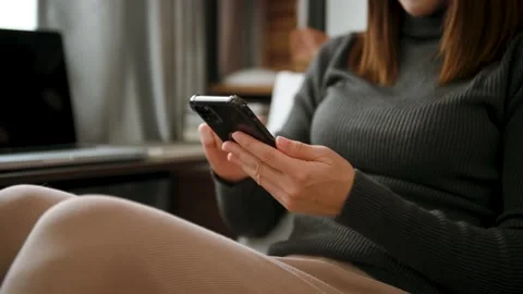 Woman using smart phone for mobile payments online shopping,omni channel,sitt Stock Footage 200870488