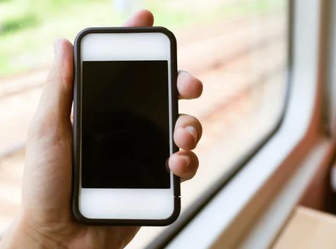 Woman using smart phone while riding the subway Stock Photos