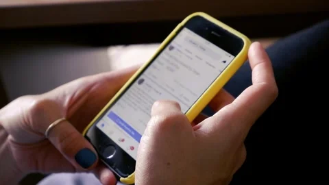 Woman using smartphone and looking social media page , reading posts Stock Footage 138998309