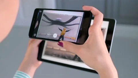 Woman using smartphone and tablet with AR application - contemporary art concept Stock Footage 169659234