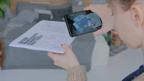 Woman using smartphone with augmented reality app Stock Footage
