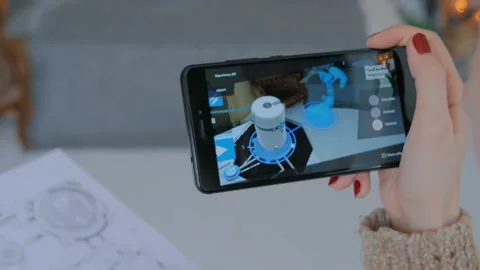 Woman using smartphone with augmented reality app Stock Footage 88413015