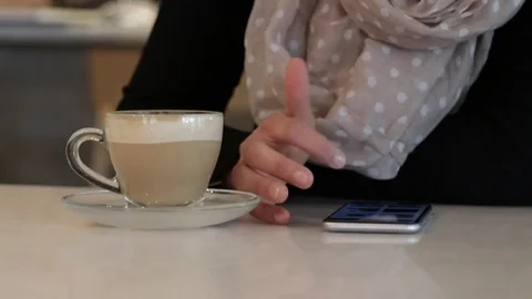 Woman using smartphone in a cafe close up Stock Footage 72275867