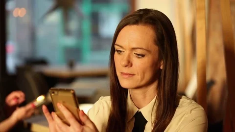 Woman using smartphone  in cafe, close Stock Footage 72307222