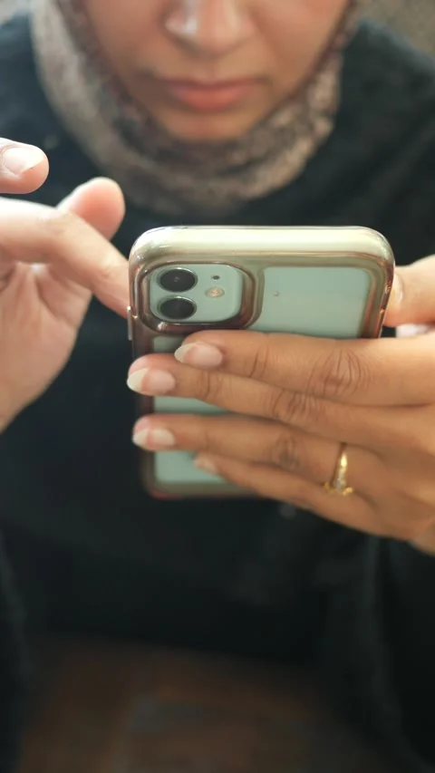 Woman using smartphone in a cafe Stock Footage 323048202
