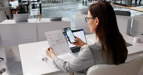 Woman Using Smartphone To Capture Document For OCR Processing In Office Envir Stock Photos