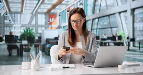 Woman Using Smartphone To Capture Document For OCR Processing In Office Envir 스톡 사진
